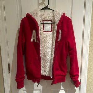 Ladies Aeropostale Red hoodie Jacket, soft cream color lining. Size L.